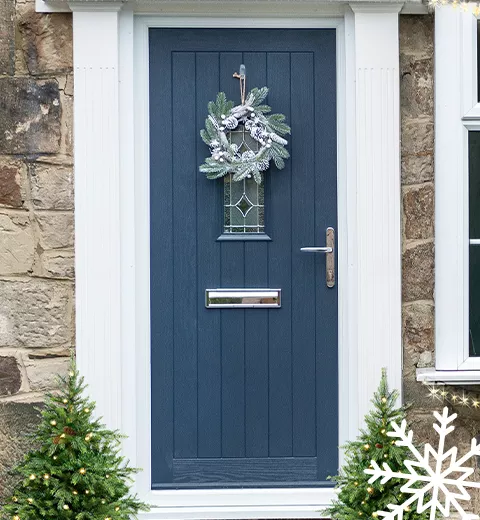 A front door with a Christmas wreath