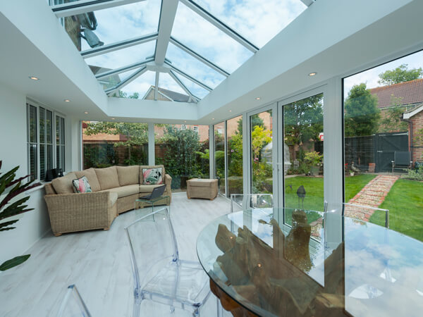 Glass-To-Floor Conservatory With French Doors